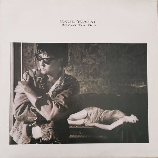 PAUL YOUNG - Between Two Fires